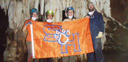 Students holding the SHSU flag